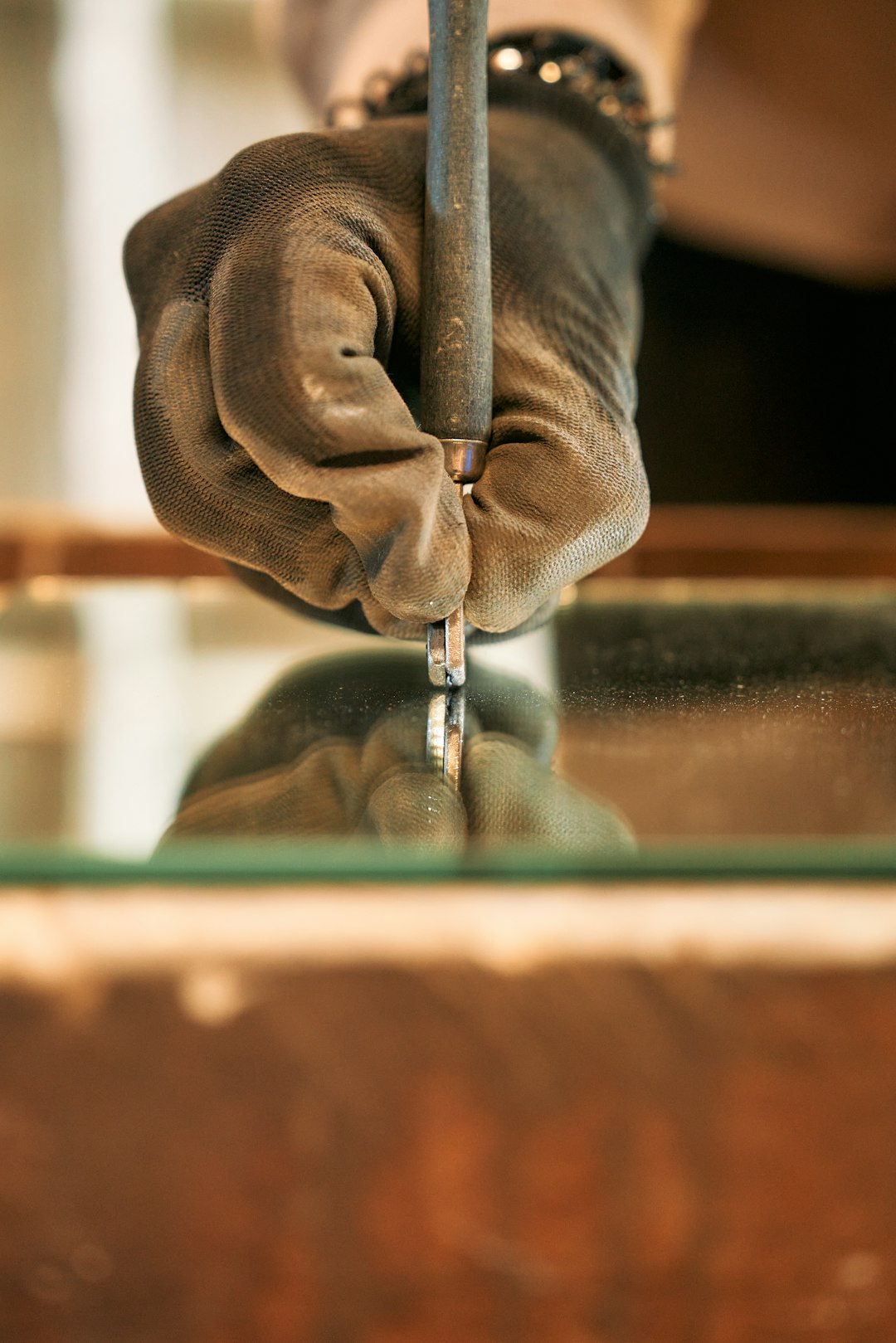 a-person-holding-a-piece-of-metal-in-their-hand-dqimbwyv6zq