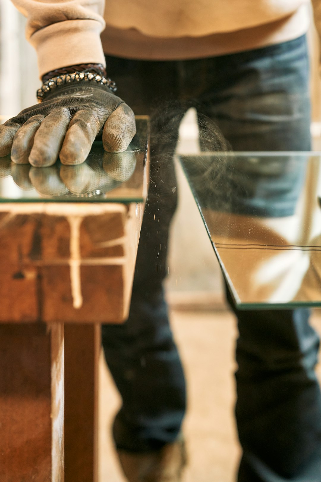 a-person-with-their-hands-on-a-glass-table-tvbdgirasmu